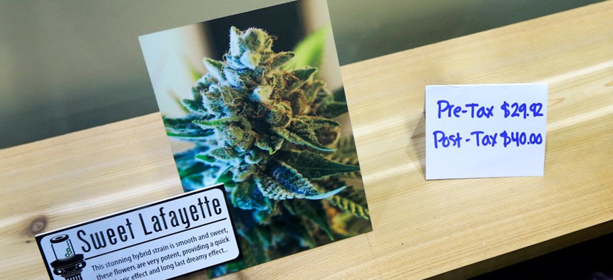 A display shows a description and price of a particular strain of marijuana at Bellingham's  Top Shelf Cannabis.