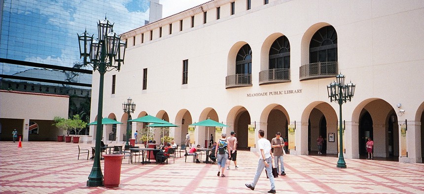 Miami-Dade Mayor Carlos Gimenez has proposed slashing nearly 100 full-time public library positions.
