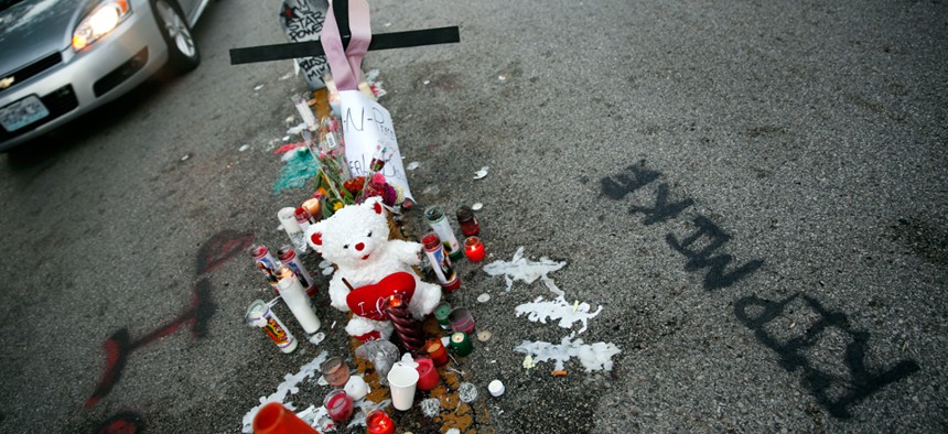 A memorial sits where Michael Brown died over the weekend.
