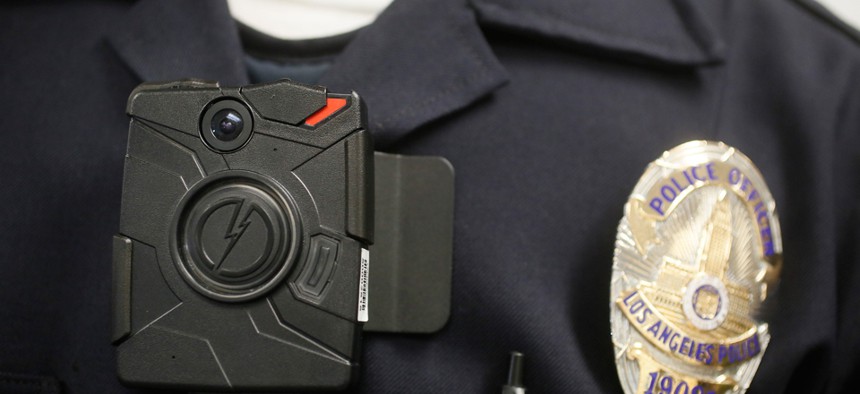 A Los Angeles Police officer wears an on-body camera, similar to the ones implemented in Ferguson, Mo., during a demonstration for media in Los Angeles.