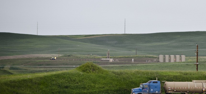 An oil truck drives through McKenzie County, North Dakota, near Watford City.