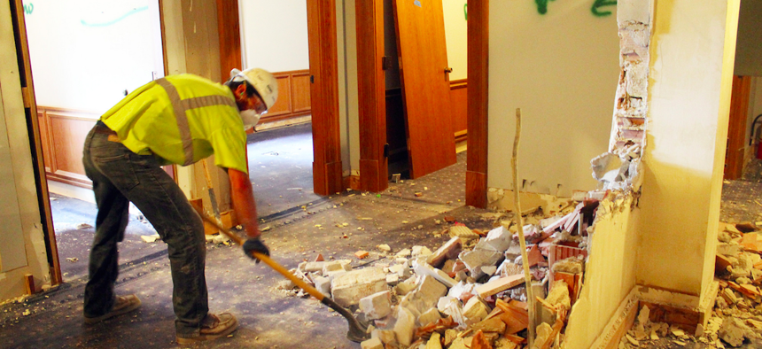 A worker begins demolition on the Minnesota Capitol's 2nd floor.