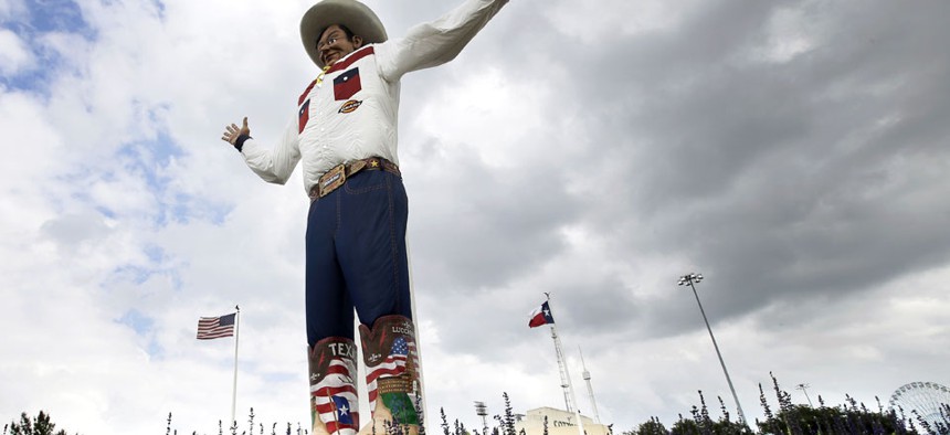 Big Tex is erected among bluebonnets at the Texas State Fair in 2013.