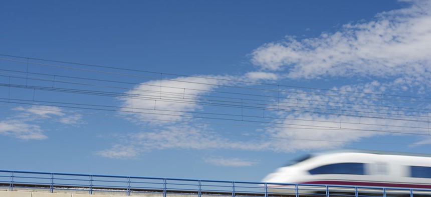 A high-speed train crosses a viaduct in El Burgo de Ebro, Spain.
