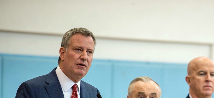 New York City Mayor Bill de Blasio, left, stand next to Police Commissioner Bill Bratton at a press conference on Dec. 2.