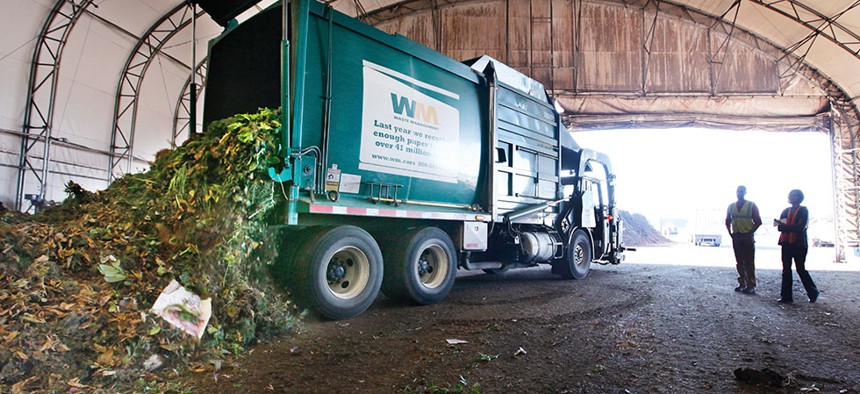 s a truck dumps compost materials inside a receiving area at the Cedar Grove processing facility in Everett, Wash. in 2011.