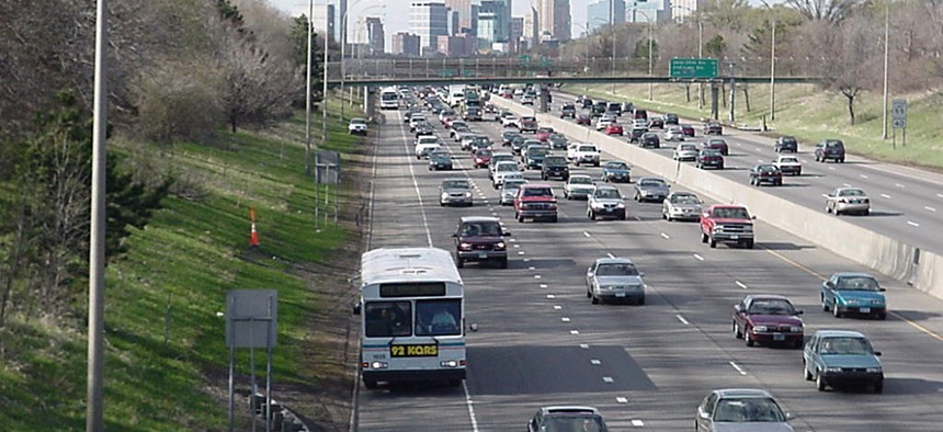 A Minnesota Valley transit bus uses the shoulder on I-35W, outside Minneapolis; some of the fleet uses lane-assist technology.