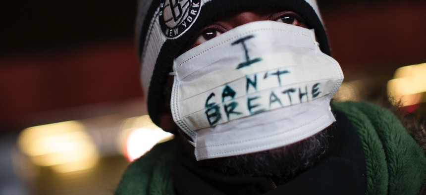 A protestor attends a Dec. 8, 2014, rally outside the Barclays Center in Brooklyn against a grand jury's decision not to indict the police officer involved in the death of Eric Garner.