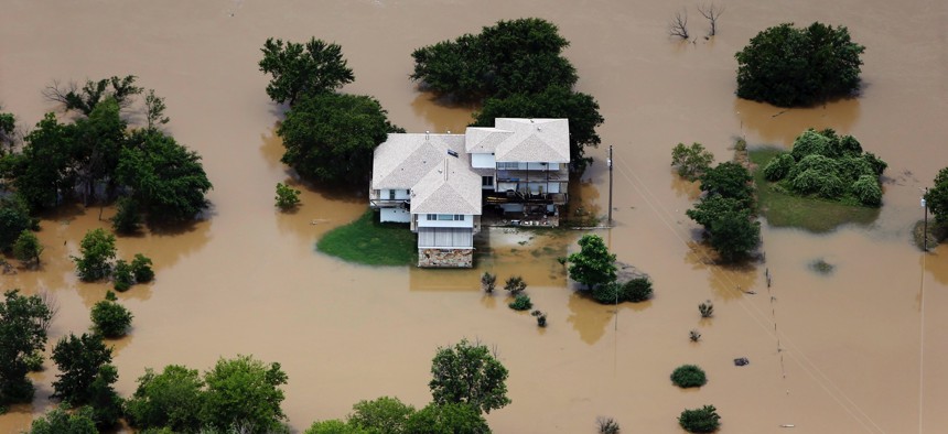 Floodwaters surround a house in Weatherford, Texas, in late May.