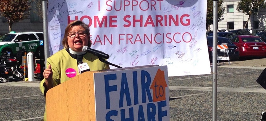 Rev. Melinda V. McLain speaks to members of HomeSharersSF during an October 2014 rally at San Francisco City Hall before a vote on the Airbnb Law.