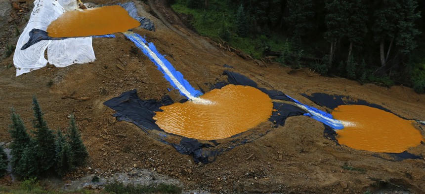 Water flows through a series of retention ponds built to contain and filter out heavy metals and chemicals from the Gold King mine wastewater accident, in the spillway about 1/4 mile downstream from the mine, outside Silverton, Colo.