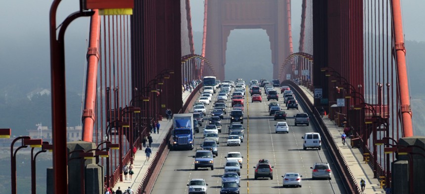 Drivers travel across the Golden Gate Bridge between San Francisco and Marin County. California requires auto insurers to charge motorists mostly based on driving record, rather than on occupation, address or education level. 