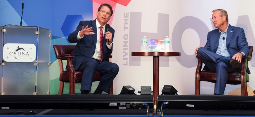 Gov. Pat McCrory (left) speaks at the Charter Schools USA Annual Summit.
