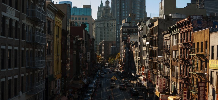 A street in Chinatown, looking toward the Manhattan Municipal Building. 
