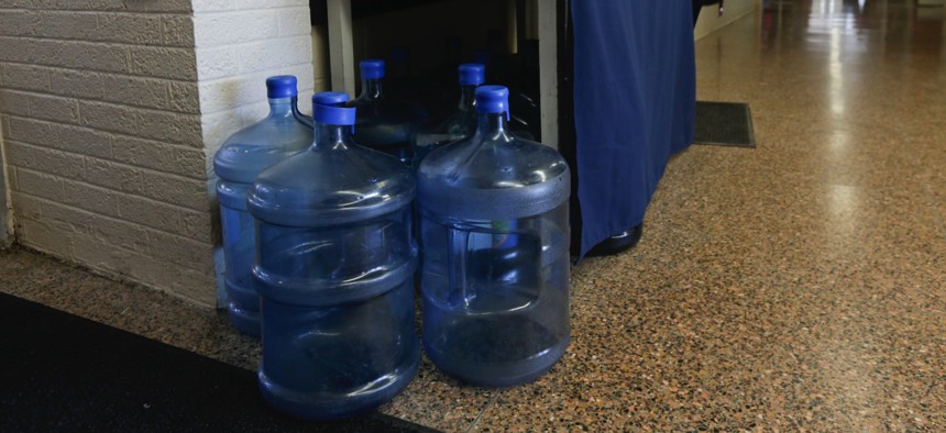 Bottles of drinking water are seen in a hallway at St. Mary's Academy in Hoosick Falls, N.Y.