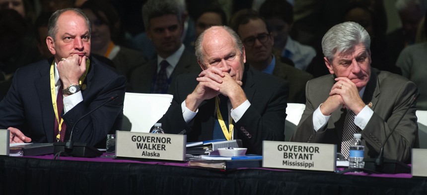 Louisiana Gov. John Bel Edwards, left, Alaska Gov. Bill Walker, center, and Mississippi Gov. Phil Bryant, right, at the National Governors Association winter meeting on Sunday, Feb. 21, 2016. 