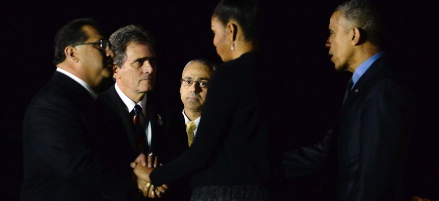 President Barack Obama and his wife Michelle greet San Bernardino County Supervisor James Ramos and San Bernardino Mayor R. Carey Davis on Dec. 18.