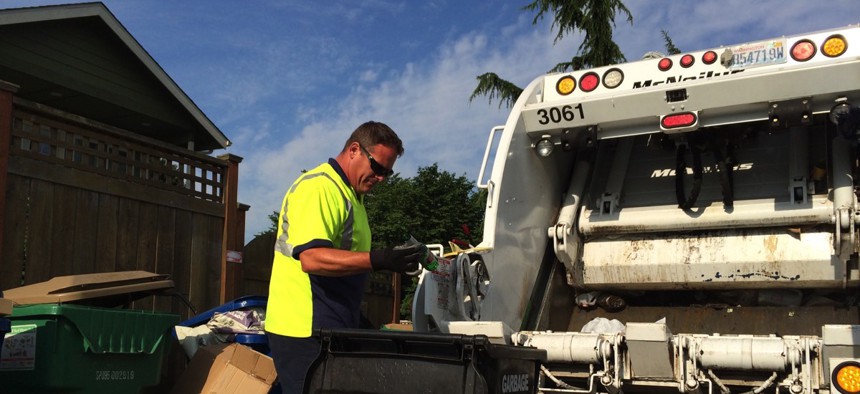 Seattle Waste Management digs through a resident's trash looking for food scraps that should've been placed with other compostable material instead.