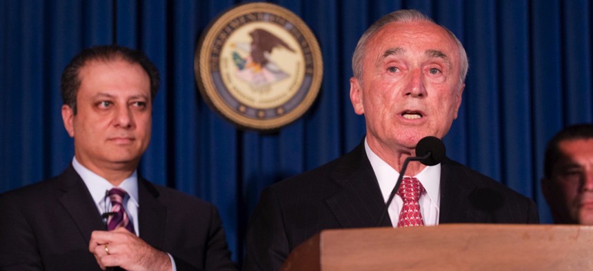 New York City Police Commissioner William Bratton, right, discusses the arrest of four people in connection with an ongoing federal corruption probe as U.S. Attorney Preet Bharara, left, looks on Monday.