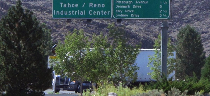 A truck leaves the Tahoe Reno Industrial Center, home to the recently opened Tesla Gigafactory, where ZIP code problems complicate sales and use tax reporting.