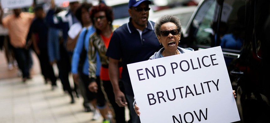 Protestors demonstrate outside the State Attorney's office calling for the continued investigation into the death of Freddie Gray in 2015.