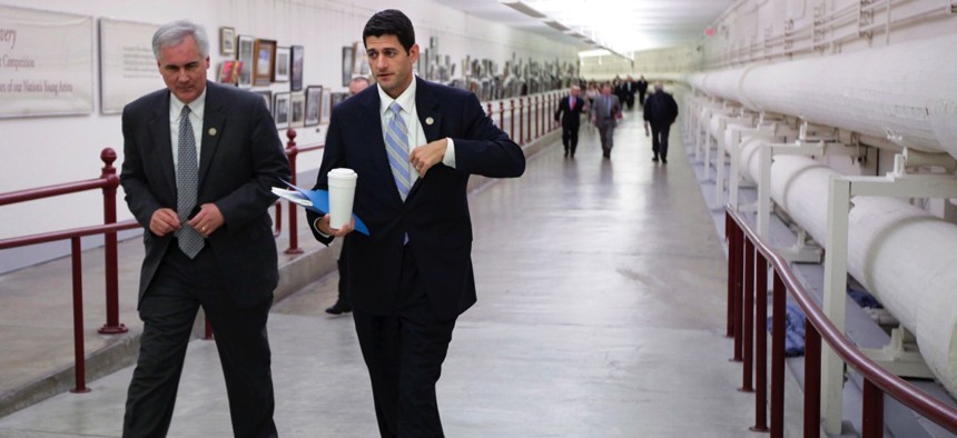 U.S. Rep. Tom McClintock, R-California, left, walks with House Speaker Paul Ryan, R-Wisconsin, right.