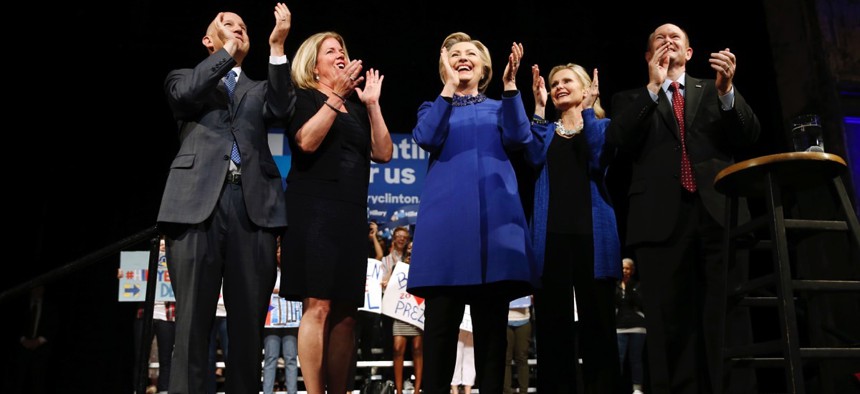 Democratic presidential candidate Hillary Clinton; Delaware Gov. Jack Markell, left; his wife, Carla; Sen. Chris Coons, right; and his wife, Annie, stand together at a campaign stop in Wilmington on April 25.