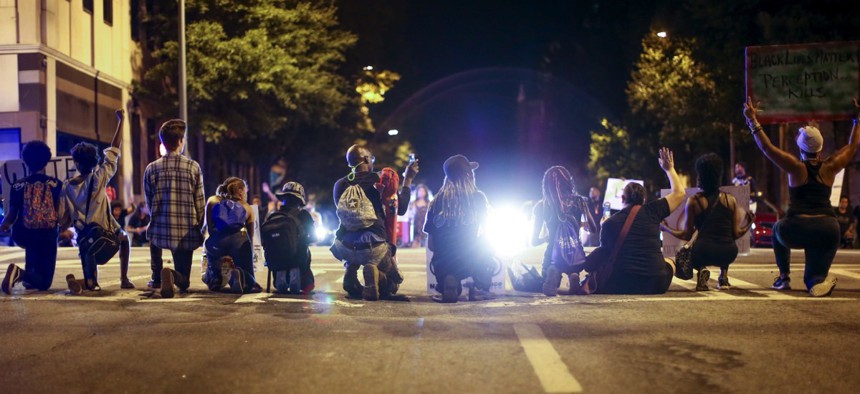 Black Lives Matter protesters sit on Peachtree Street during a protest in downtown Atlanta on Saturday.