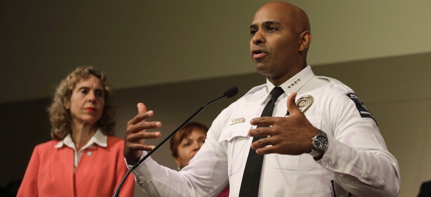 Police Chief Kerr Putney, right, gestures as Mayor Jennifer Roberts, left, watches during a news conference concerning protests over the fatal police shooting of Keith Lamont Scott in Charlotte, N.C.