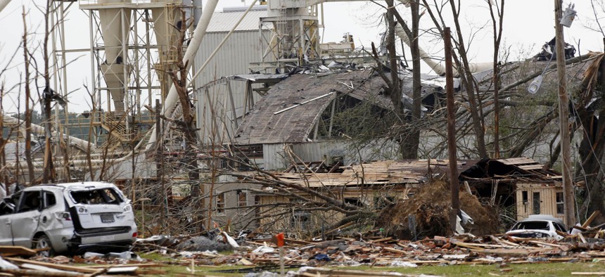 In a Tuesday, April 29, 2014 file photo, a wood products plant and its surrounding properties show the heavy damage from Monday's tornado in south Louisville, Miss.