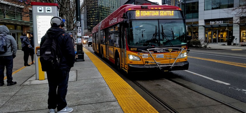 A hybrid-electric RapidRide bus, travels along Westlake Avenue in Seattle. 