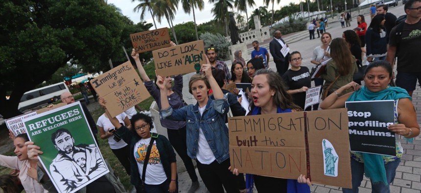 Protesters chant slogans against President Donald Trump's executive order on Muslim immigration Thursday in downtown Miami.