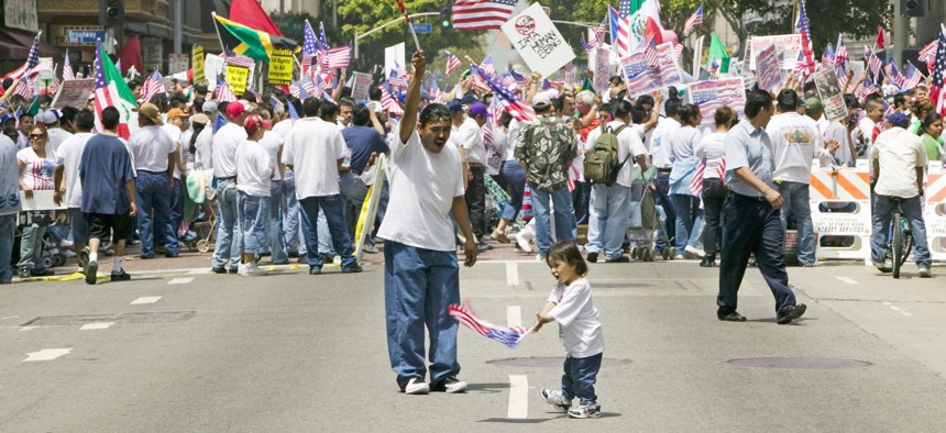 A father and daughter at a protest in solidarity with undocumented immigrants in Los Angeles, California.