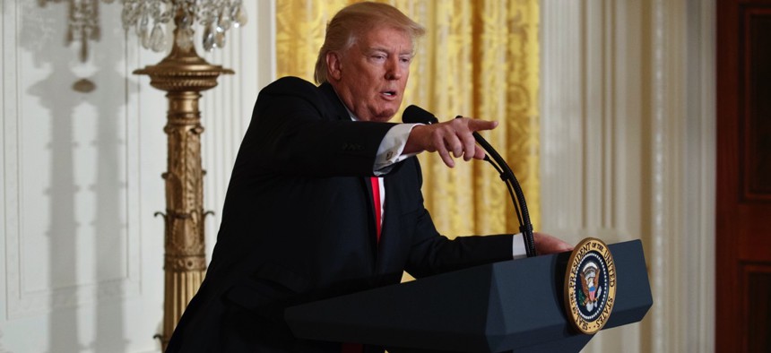 President Trump speaks during a Thursday news conference in the East Room of the White House.