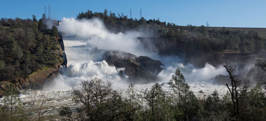 Water pours through the main spillway of the Oroville Dam on Feb. 12