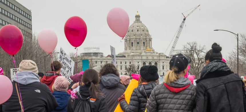 A group of people with pink balloons gather at the state capitol during the Women's March in St. Paul, Minnesota, on January, 21, 2017.