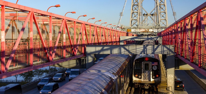 The Williamsburg Bridge in New York City carries cars, trucks and subway trains between Brooklyn and Manhattan.