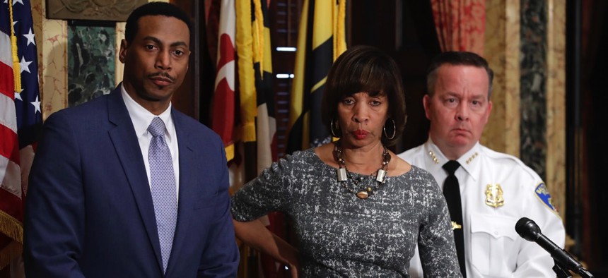 Interim City Solicitor David Ralph, Baltimore Mayor Catherine Pugh and Baltimore Police Department Commissioner Kevin Davis answer questions on the U.S. Department of Justice's request for a continuance on a consent decree hearing.