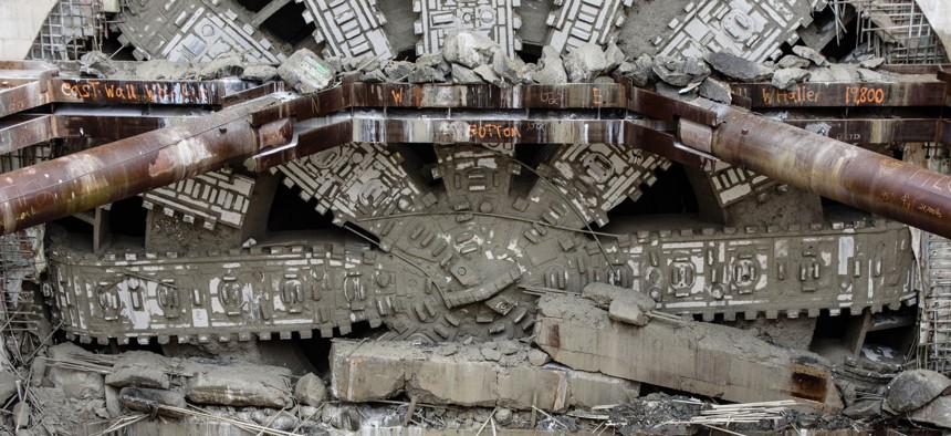 Bertha, which launched as the world's largest tunnel-boring machine, crashes through its concrete finish line on April 4.