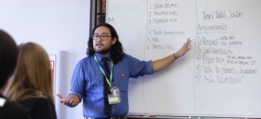 Justin Balido, peer health coordinator and senior health educator with Health Connected, speaks to a ninth-grade Teen Talk High School class at Carlmont High School in Belmont, Calif.