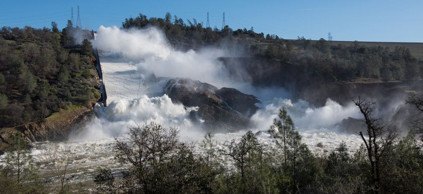 Water pours through the main spillway of the Oroville Dam in February.
