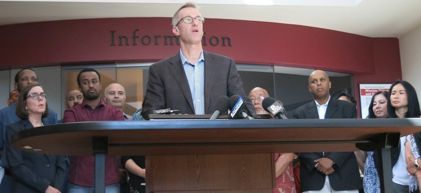 Portland Mayor Ted Wheeler speaks at a news conference after a man fatally stabbed two men Friday on a light-rail train when they tried to stop him from yelling anti-Muslim slurs at two young women, one of whom was wearing a hijab.