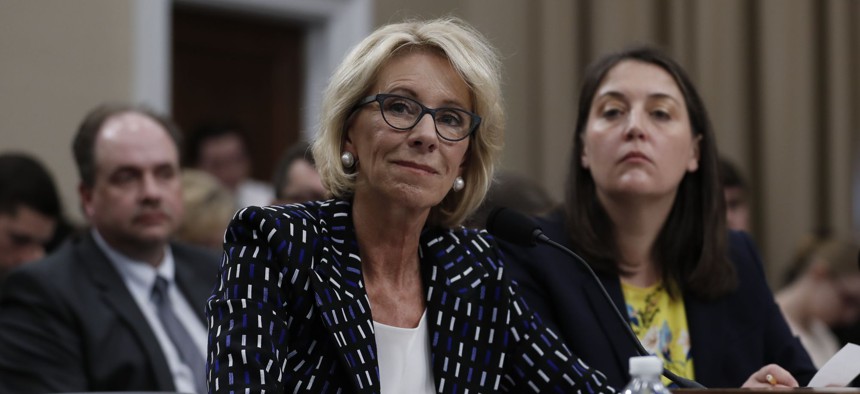 Education Secretary Betsy DeVos, left, joined by Education Department Budget Service Director Erica Navarro, testifies on Capitol Hill in Washington, Wednesday, May 24, 2017
