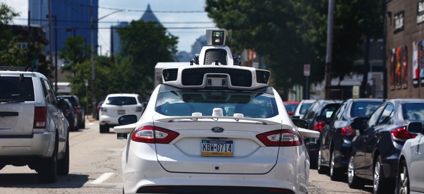 One of Uber's autonomous vehicles navigates Pittsburgh's roads.