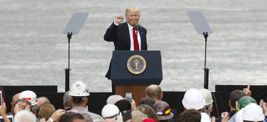 President Donald Trump gestures to the crowd after speaking during a rally at the Rivertowne Marina, Wednesday, June 7, 2017, in Cincinnati. 