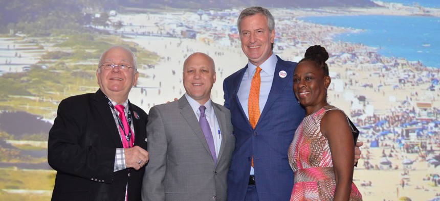 From left, USCM Executive Director Tom Cochran, New Orleans Mayor Mitch Landrieu, New York City Mayor Bill de Blasio with his wife, Chirlane McCray.