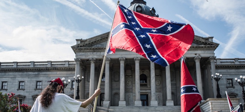 Protesters contest the Confederate battle flag's removal from the grounds of the Statehouse in Columbia, S.C.