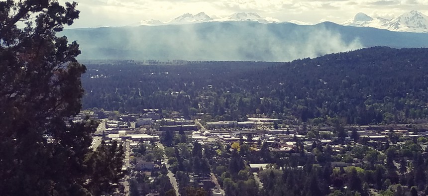 Smoke from a controlled burn rises west of Bend, Oregon