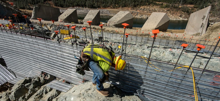 Workers install stay-forms before concrete is poured on the lower chute of the Lake Oroville flood control spillway in Butte County, California, on July 12.
