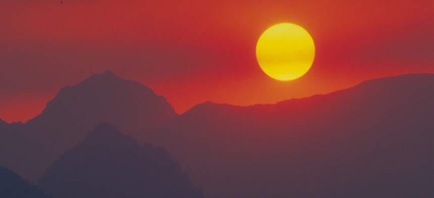 Sunset over Glacier National Park, in Montana, with forest fire haze.